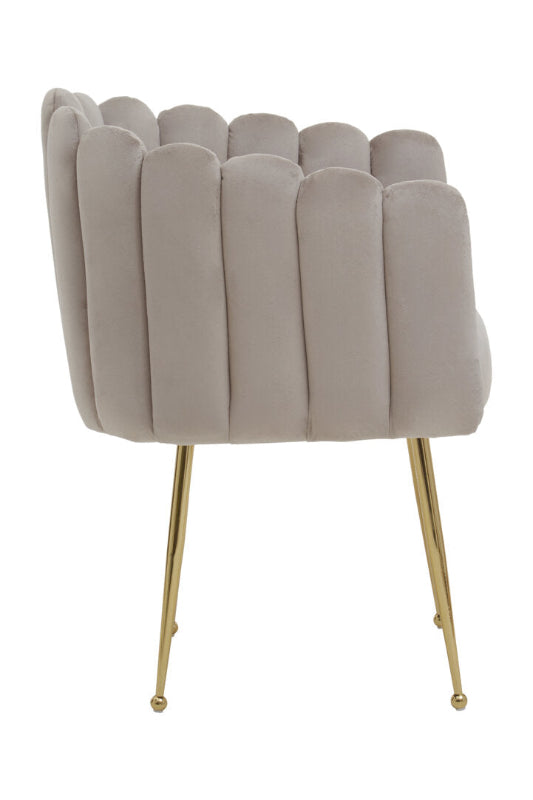 Beige velvet chair with gold legs on a white background
