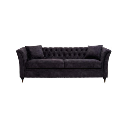 Dark gray tufted sofa with two cushions on a white background