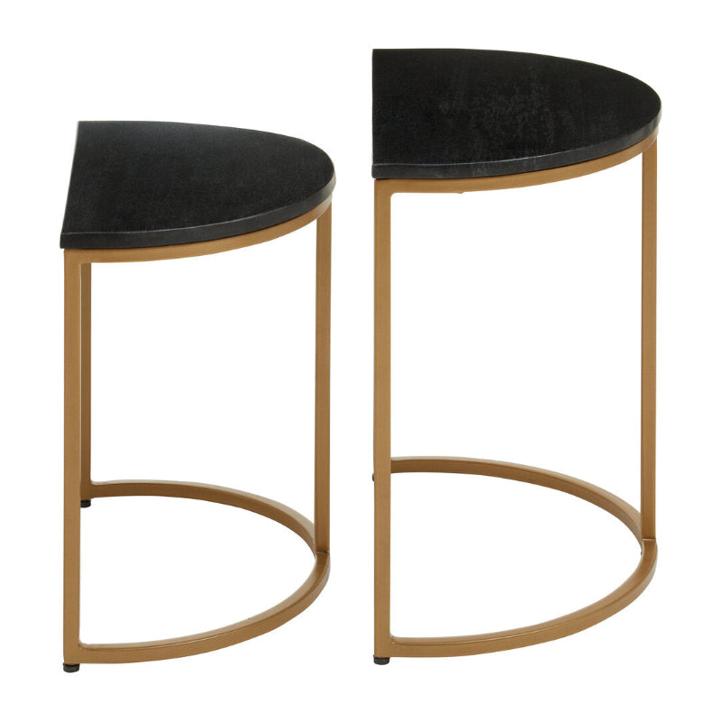 Two black marble top and gold metal frame stools on a white background