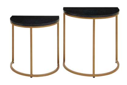 Two half-moon side tables with black marble tops and gold metal frames on a white background.