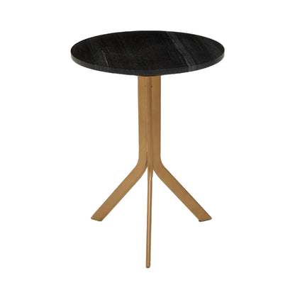 Small round table with black top and gold metal legs on a white background
