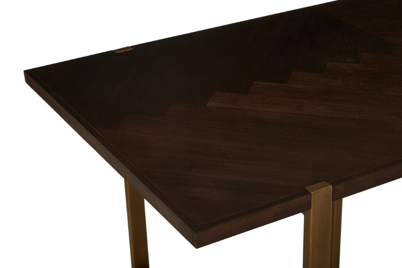 Dark wooden table top and brass legs on a white background