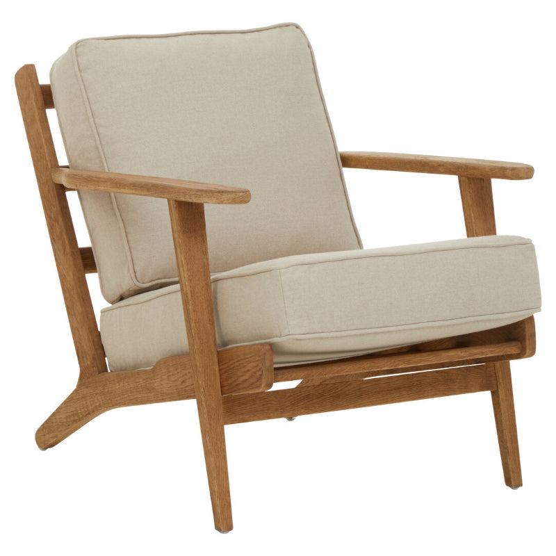 Wooden armchair with beige cushions on a white background
