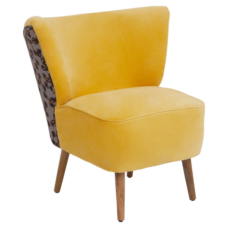 Yellow armchair with patterned backrest on a white background