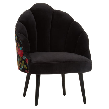 Black velvet armchair with floral armrest on a white background