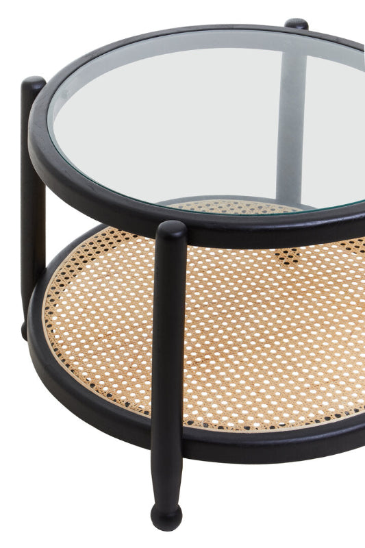 Round coffee table with glass top and woven wicker bottom on a white background