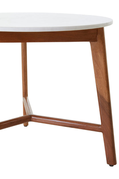 Round table with white top and wooden legs on a white background