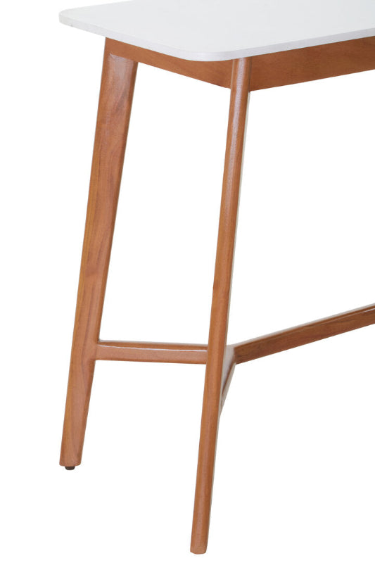 Close-up of a wooden table with a white surface on a white background