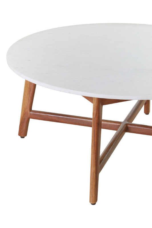 Round coffee table with a white top and wooden legs on a white background