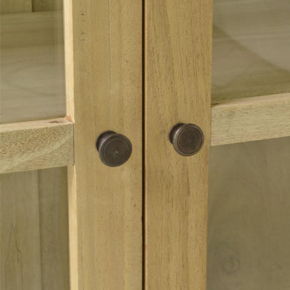 Close-up of a light natural wood cabinet door with two round dark metal knobs.