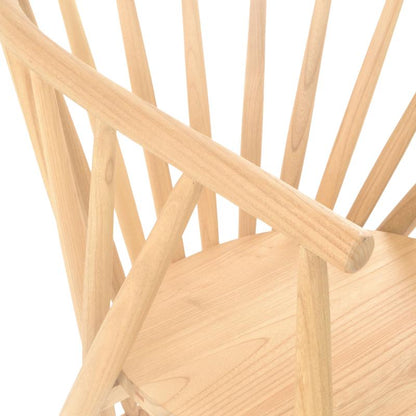 Close-up of a light natural wood chair showing the seat, backrest slats, and armrests against a plain white background.