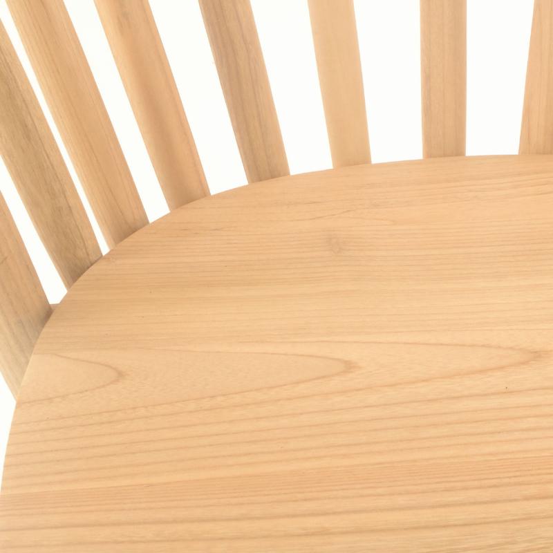Close-up of a light natural wood chair surface with curved slatted backrest visible above.