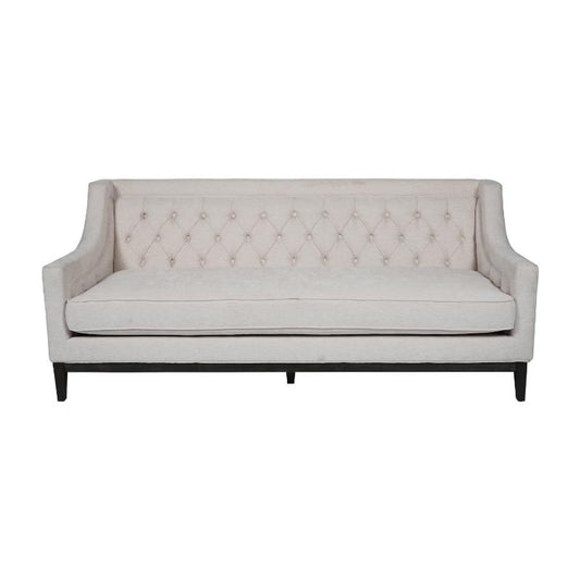 A light beige upholstered loveseat with diamond tufting on the backrest and dark wooden legs, shown against a plain white background.
