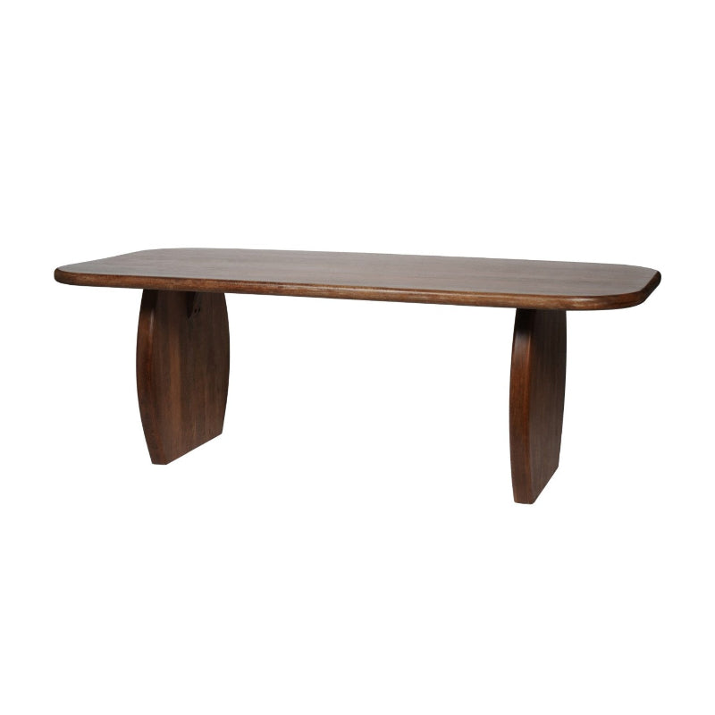 A mid-century modern wooden dining table with a dark brown finish, featuring a rounded rectangular top and two sculptural curved legs, shown against a plain white background.