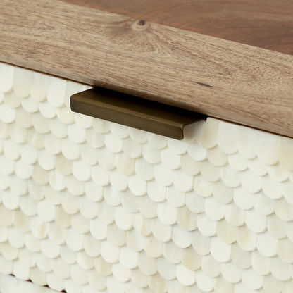 Close-up of a wooden drawer with a metal handle on a textured white surface