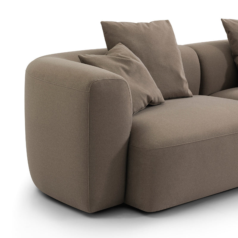 Brown sofa with cushions on a white background