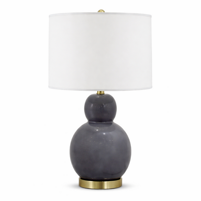 Gray table lamp with a white shade on a white background