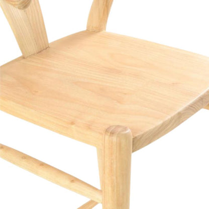 Close-up of a light natural wood chair seat and part of the wooden frame on a white background.