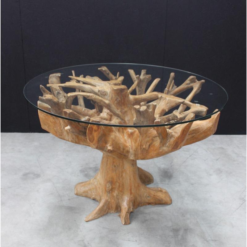 Wooden table with a glass top on a gray surface against a black background