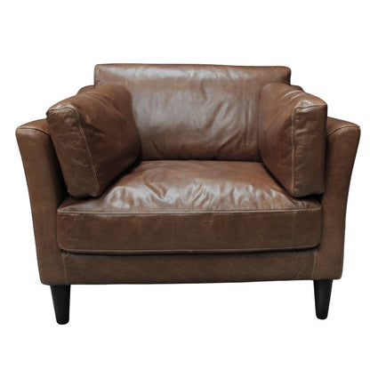 A brown leather armchair with a low back, wide armrests, and dark tapered legs, shown against a plain white background.