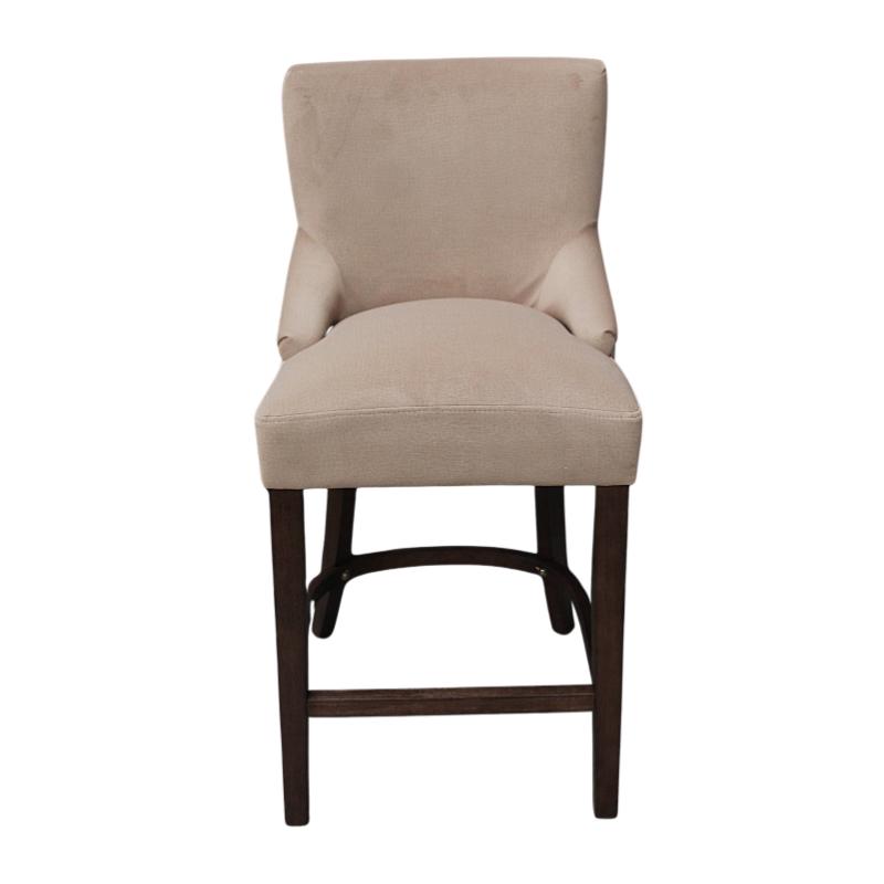 An upholstered bar stool with a beige fabric seat and backrest, supported by dark brown wooden legs and a footrest, shown against a plain white background.