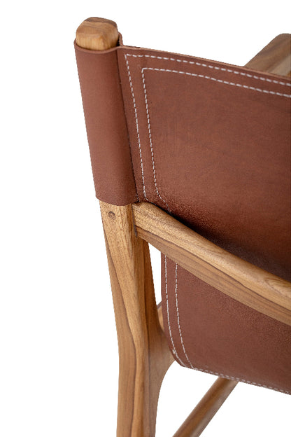 Close-up of a brown leather chair with wooden armrests on a white background