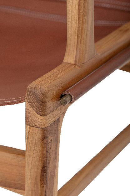 Close-up of a wooden chair with brown leather seat and backrest.