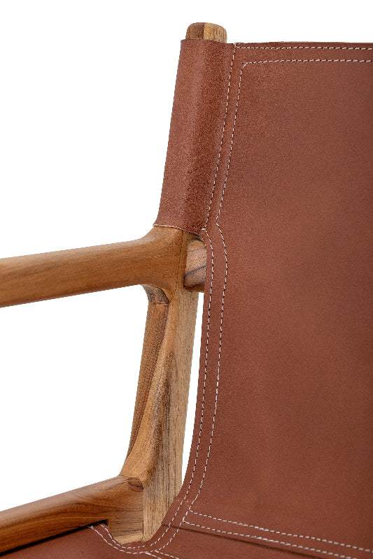 Close-up of a brown leather chair with wooden armrests on a white background