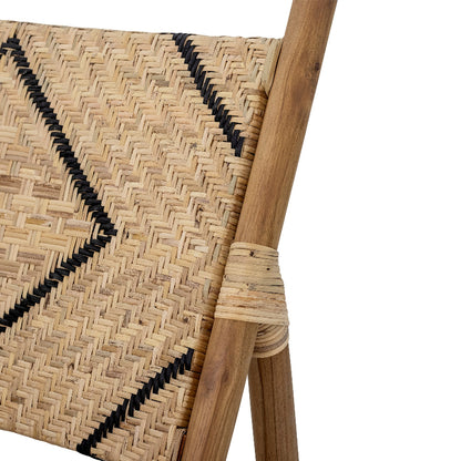 Close-up of a woven chair with wooden armrests on a white background