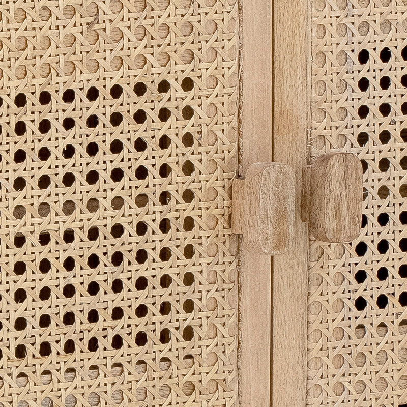Close-up of a wooden cabinet with intricate lattice design and door handles.