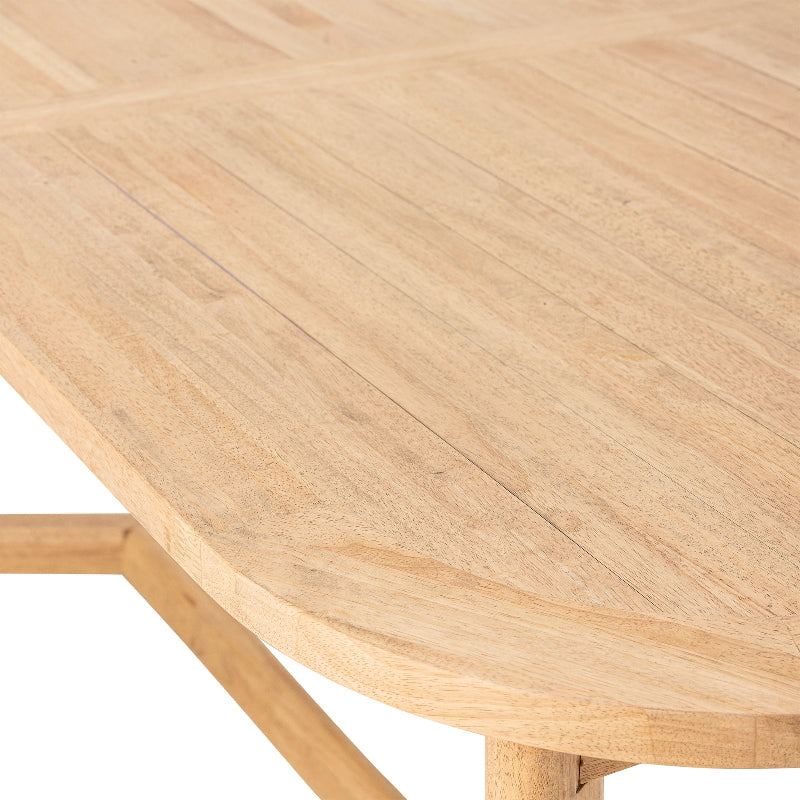 Close-up of a wooden table with a light finish