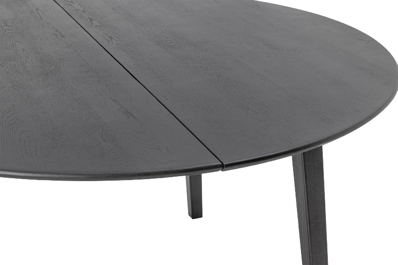 Round dark gray dining table with a visible grain pattern on a white background