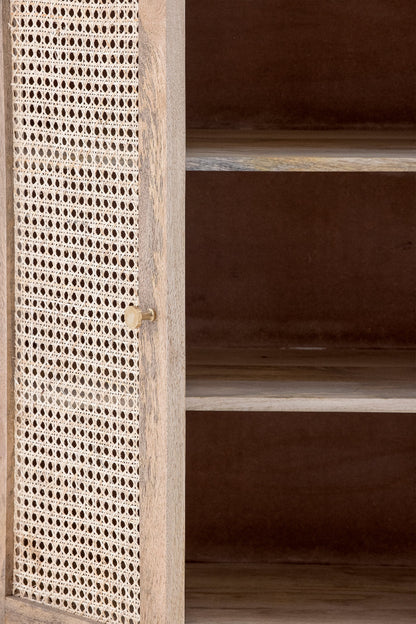 Wooden cabinet with rattan door panel on a dark background