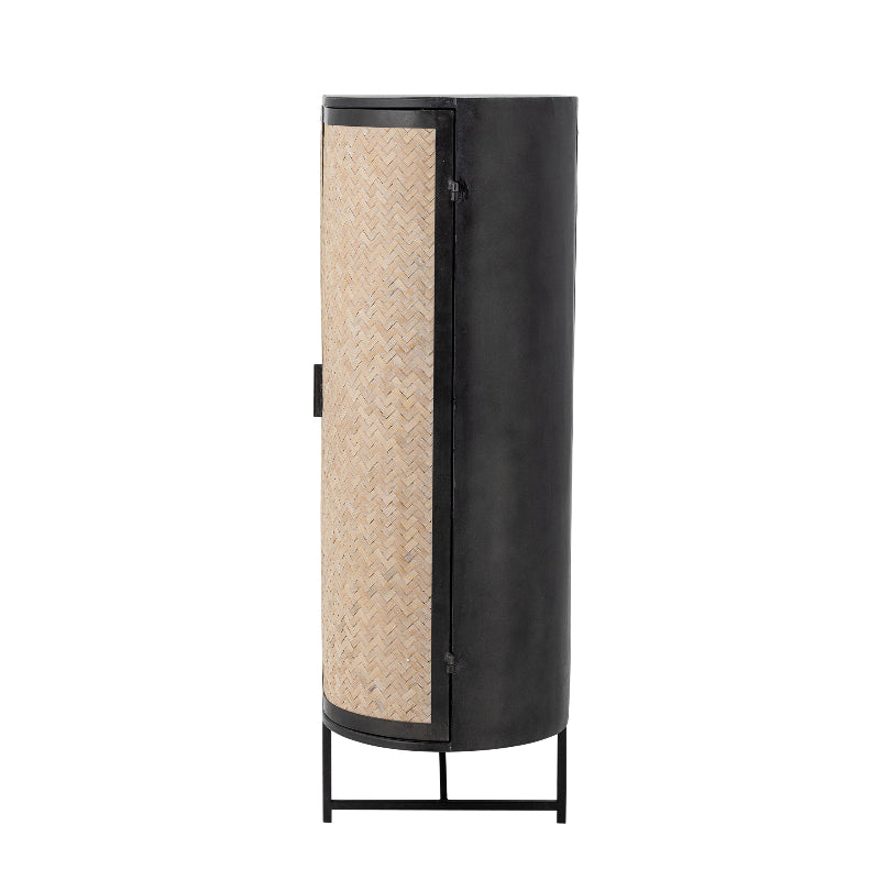Cylindrical cabinet with black metal frame and woven design on a white background