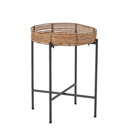 Round woven basket on a metal stand against a white background