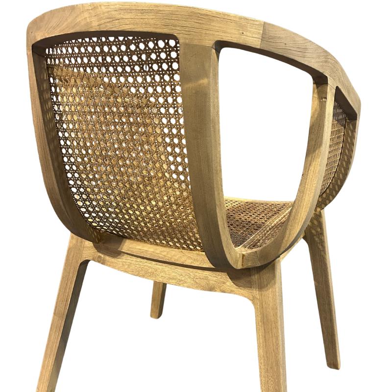 A light brown wooden armchair with a woven cane backrest and seat, shown from a three-quarters angle against a plain white background.