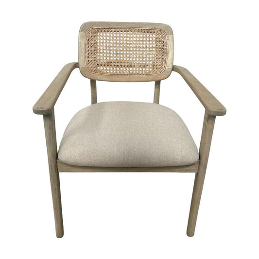 A light gray wooden armchair with a woven cane backrest and a beige upholstered seat cushion, shown from a front-facing perspective on a white background.