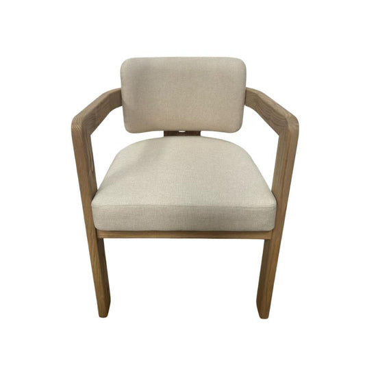 A modern dining chair with a light beige textured fabric seat and backrest, supported by a curved medium-brown wooden frame, shown against a plain white background.