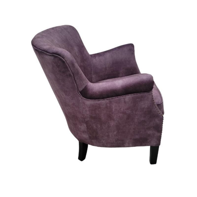 A single upholstered accent chair in a vintage charcoal velvet fabric, shown from a three-quarters angle against a plain white background.