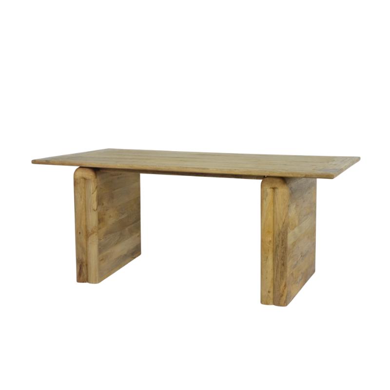 A rustic wooden table with a rectangular light brown tabletop and two thick, blocky legs made from stacked wooden planks, shown against a plain white background.
