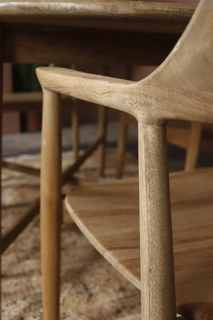 Close-up of a wooden chair with a blurred background