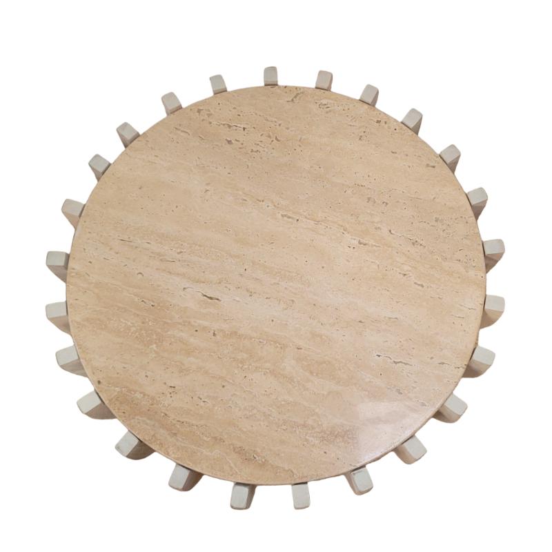 A round coffee table made of light beige travertine stone with a raised outer rim and small protruding legs, shown from a top-down view on a white background.