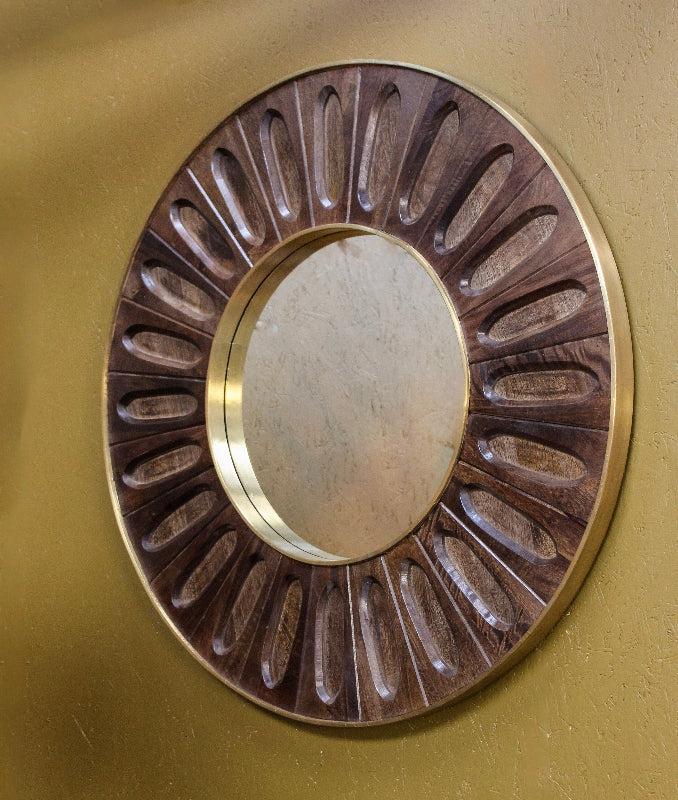 Decorative circular metal plate with concentric circles on a gold background