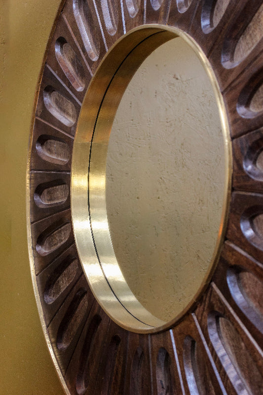 Close-up of a brass circular object with a detailed background