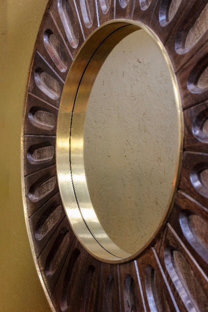 Close-up of a brass circular object with a detailed background