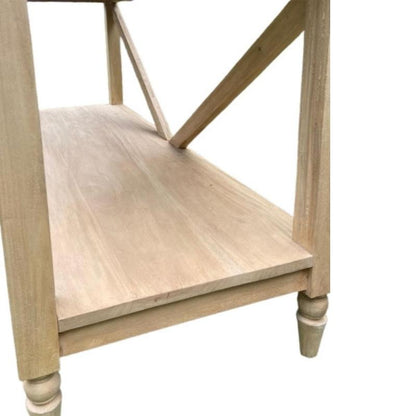 Close-up of a light natural wood furniture piece, showing the shelf, leg, and decorative turned feet against a plain white background.