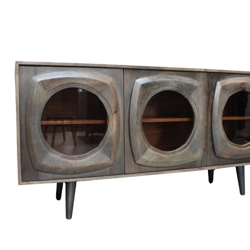 Mid-century modern sideboard cabinet with three circular glass-front doors and tapered legs, shown against a plain white background.