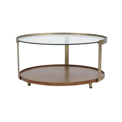A round two-tier coffee table with a clear glass top, a warm brown wooden lower shelf, and a brushed brass metal frame and legs, shown on a plain white background.