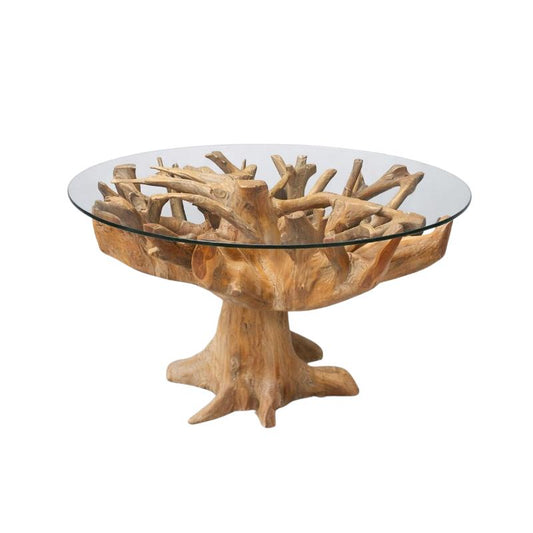 A round glass-top table with a natural driftwood or tree-root base, photographed on a clean light gray studio background.