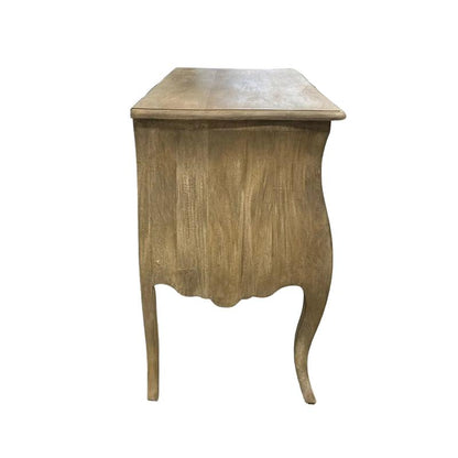 A small wooden side table with a distressed light brown finish, featuring a rectangular top, curved front panel, and two curved cabriole-style legs, shown against a plain light gray background.